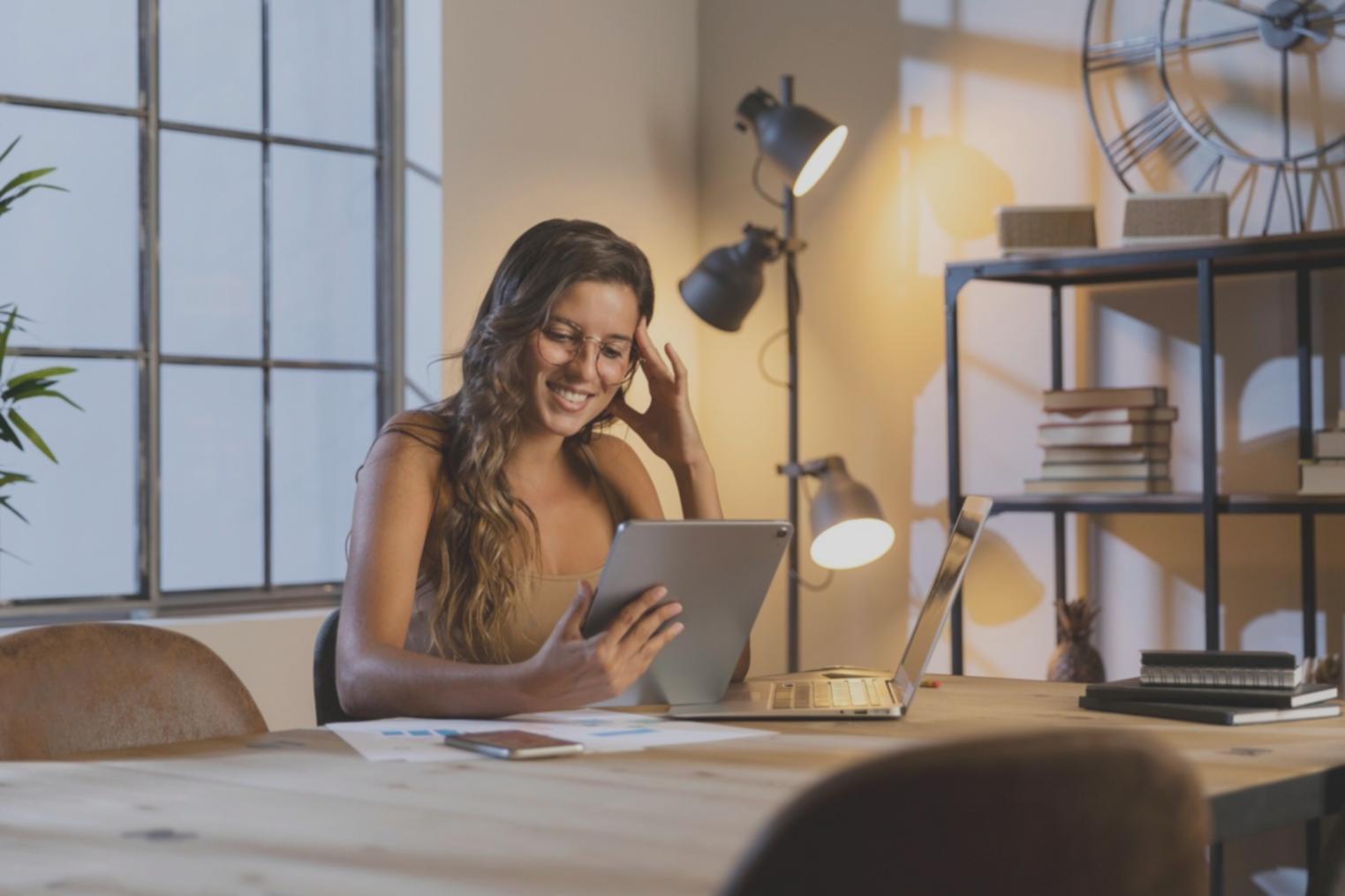 Business professional analyzing financial charts and data on laptop computer