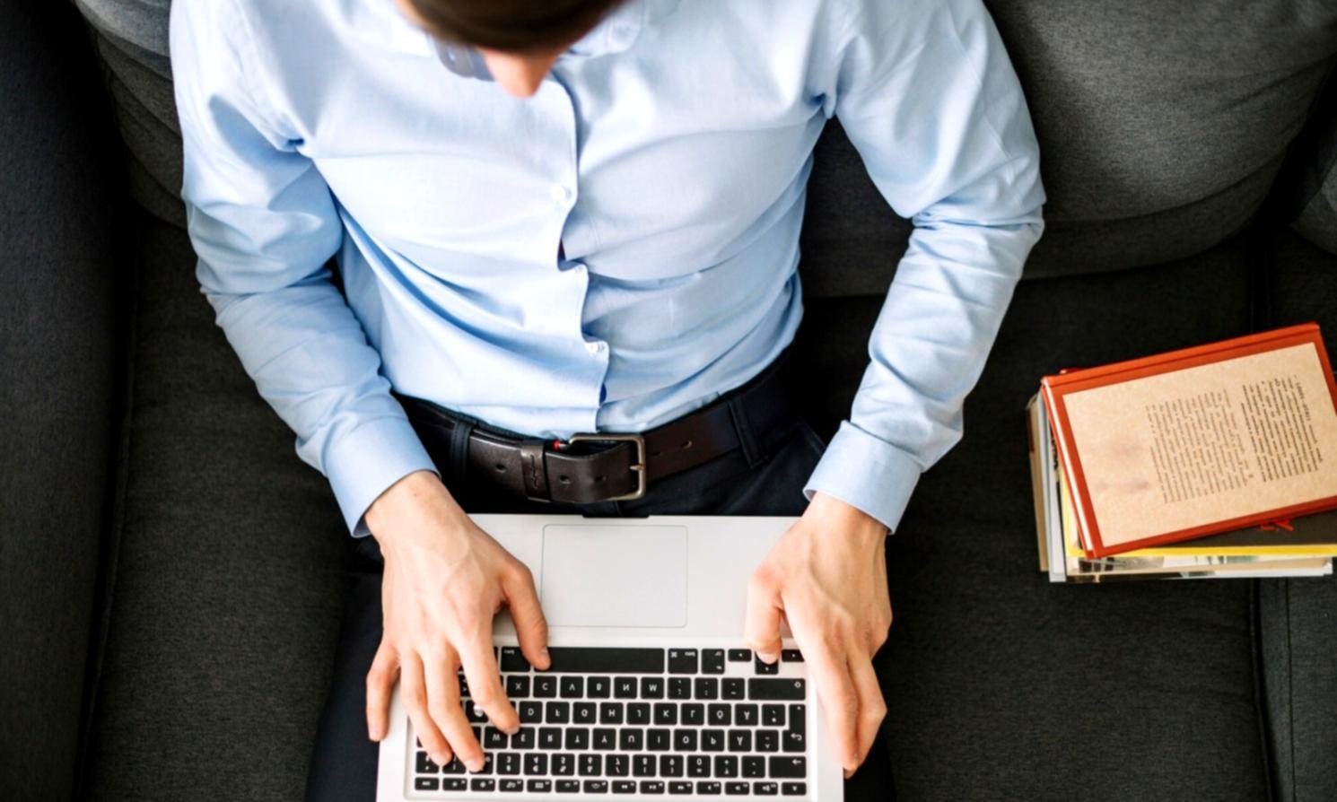 Business meeting with financial charts and planning materials spread on conference table